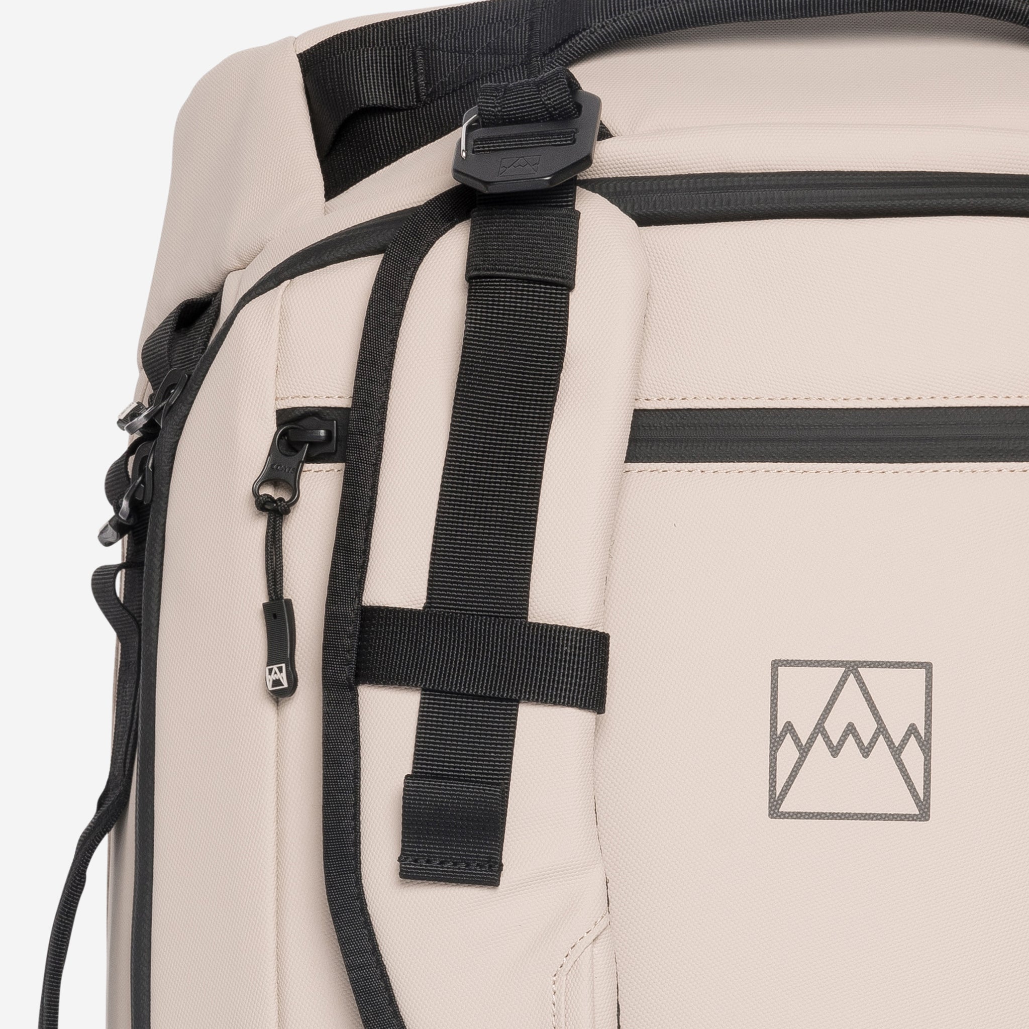 A close up of the adjustable and removable straps on the Kit Bag 40L in Sand