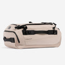 A studio shot showing the side and end of a Kit Bag 40L in Sand