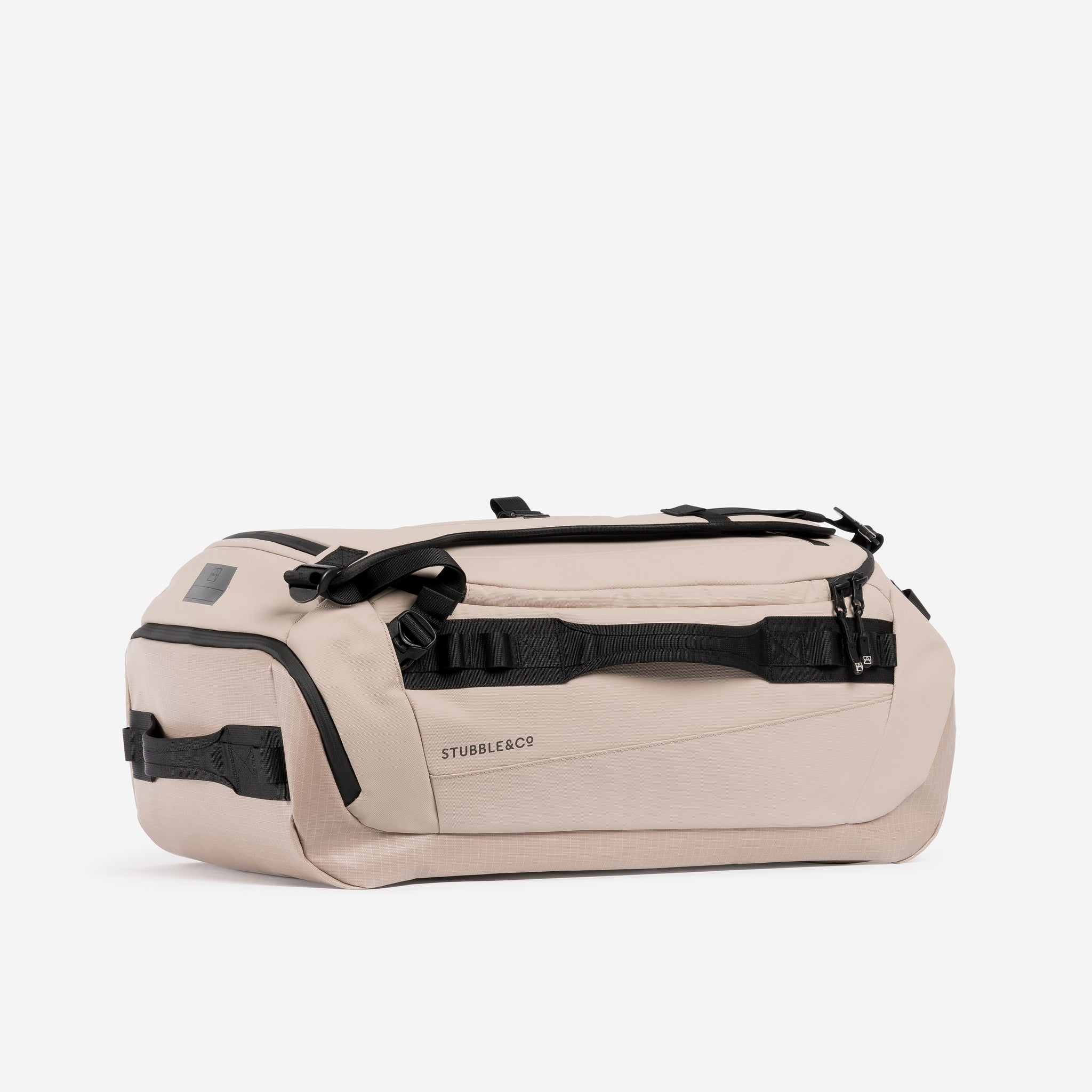 Kit Bag 40L in Sand resting horizontally against a plain white background.