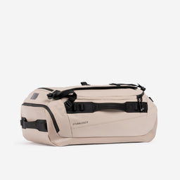 Kit Bag 40L in Sand resting horizontally against a plain white background.