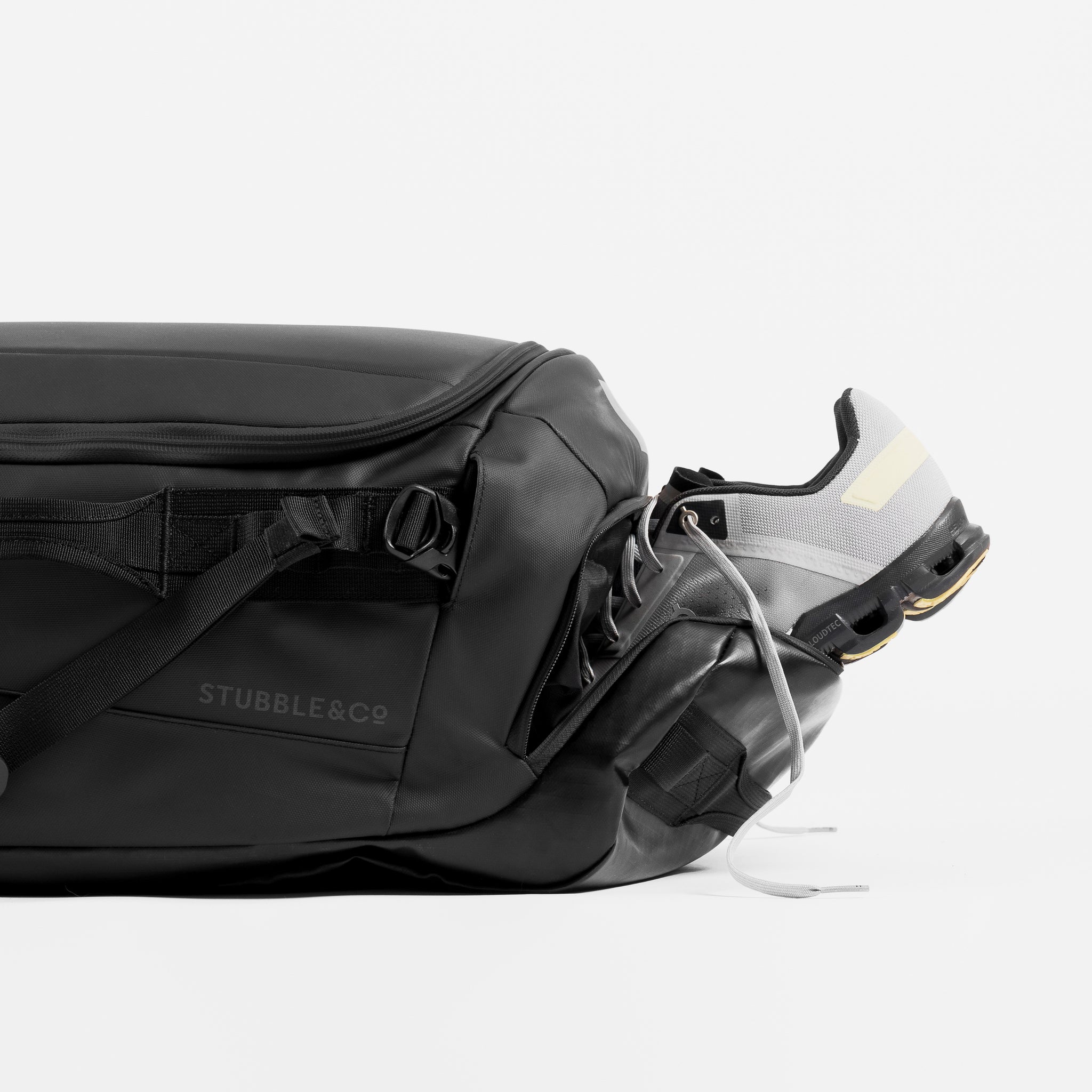 A studio shot of the shoe compartment on a black kit bag 40l [All variants]