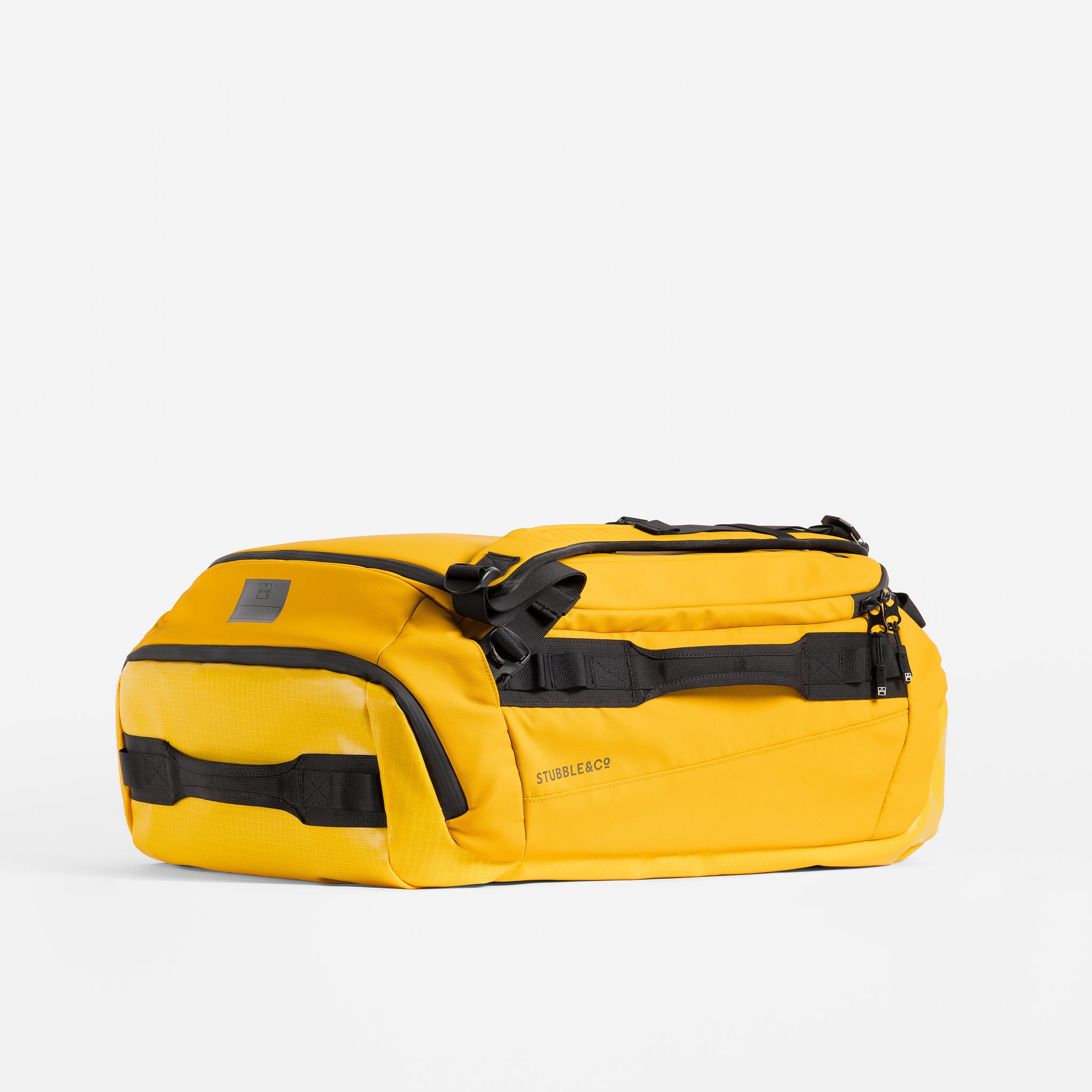 Kit Bag 40L in Yellow resting horizontally on a plain white background.