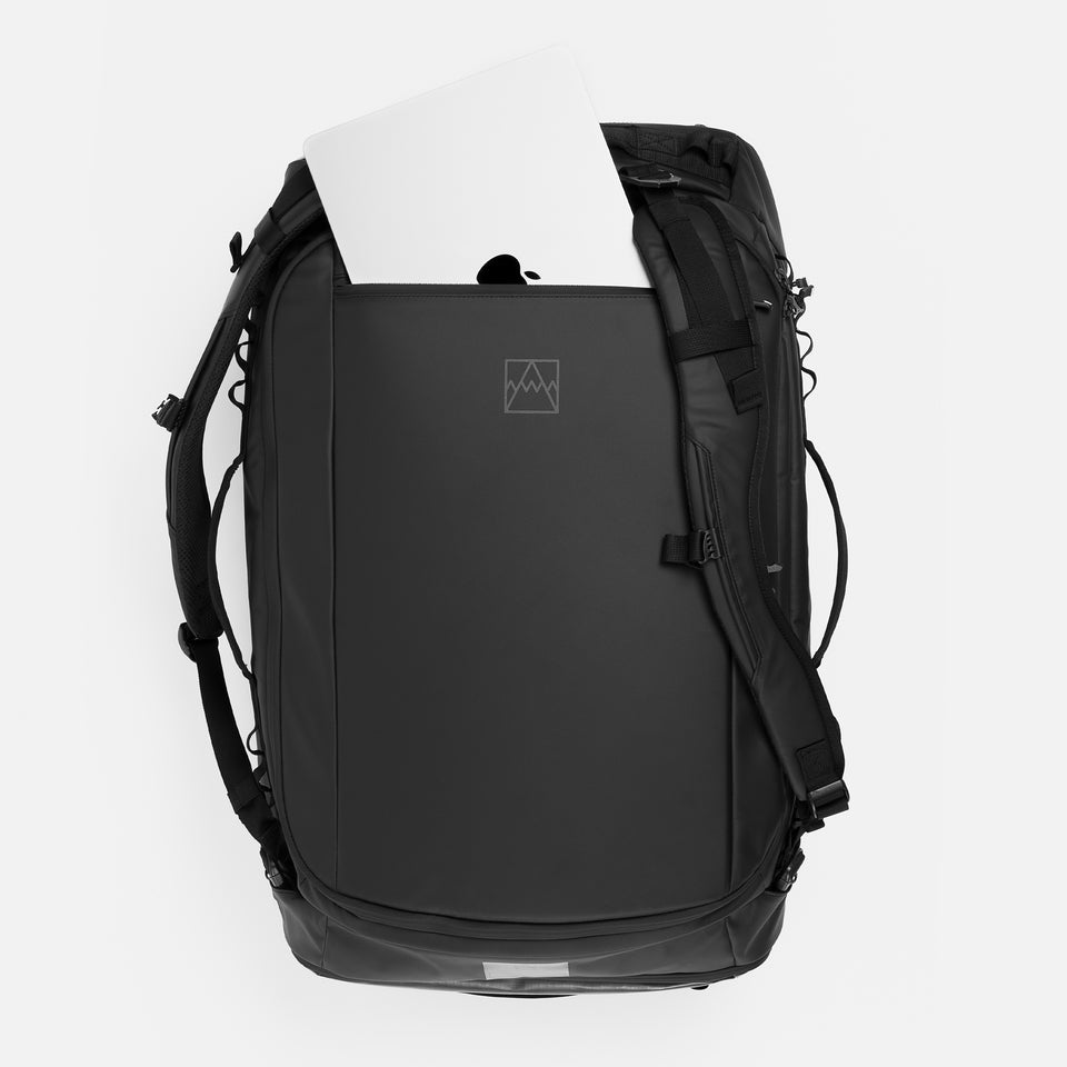 A studio shot of the laptop compartment of an All Black Kit Bag 65L