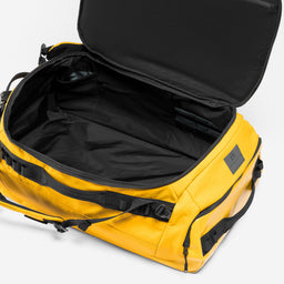 A studio shot of the interior of the Yellow Kit Bag 65L