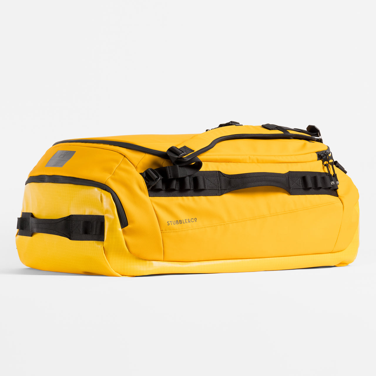A studio shot of the top and side grab handles on a Kit Bag 65L in Yellow