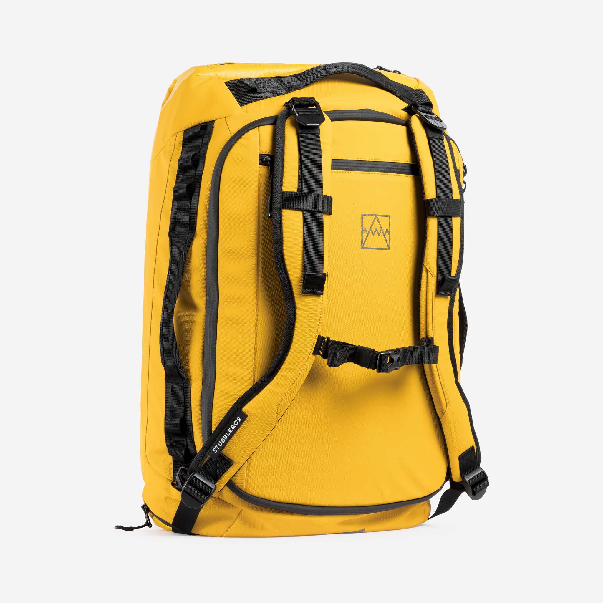 A studio shot of the Yellow Kit Bag 65L standing up showing the back straps