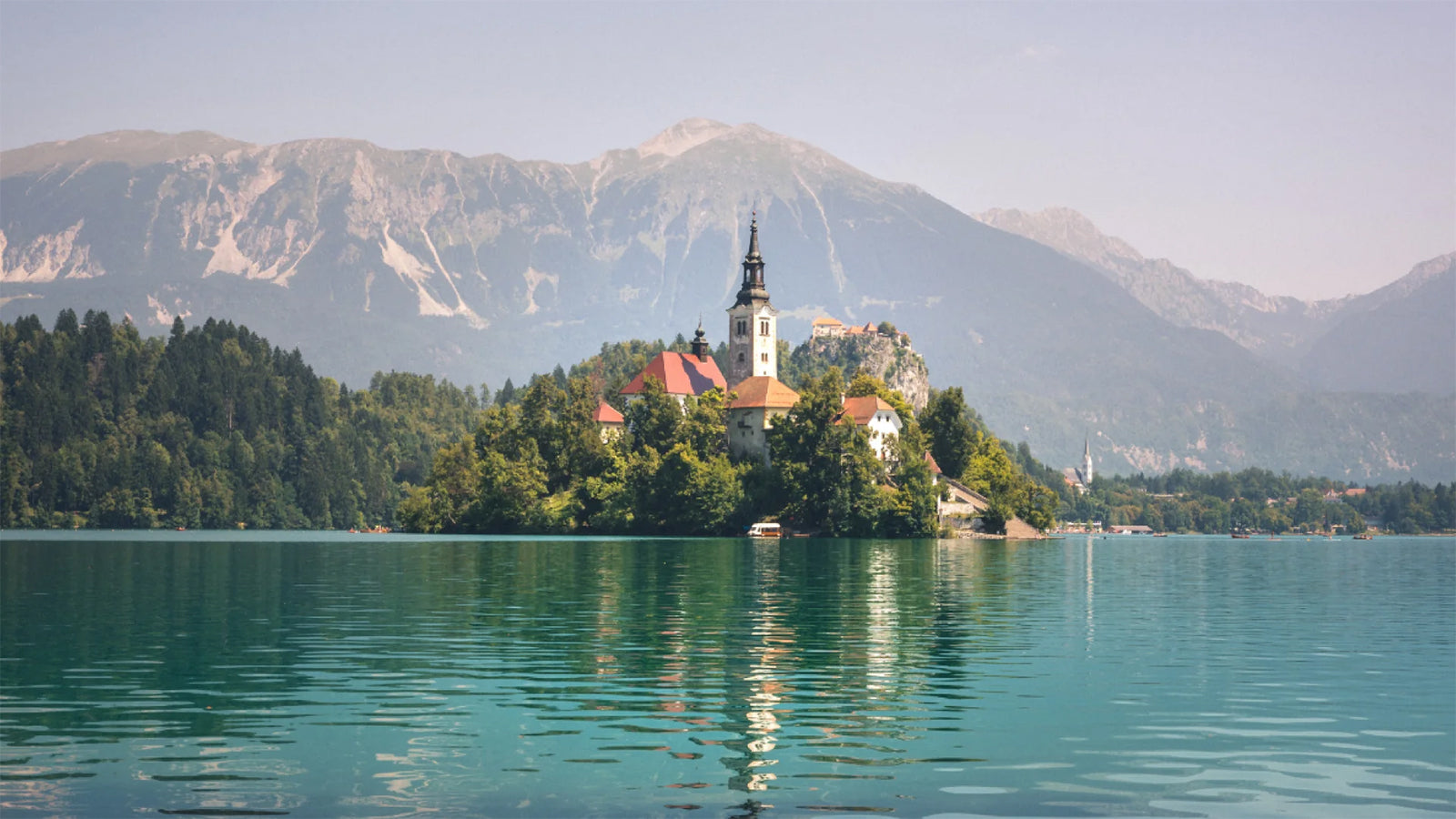 A picture of a lake with an island 