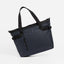A studio shot of the Laptop Tote 20L in Midnight Blue hanging at an angle