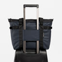 A studio shot showing the luggage sleeve on the Midnight Blue Laptop Tote Bag 20L