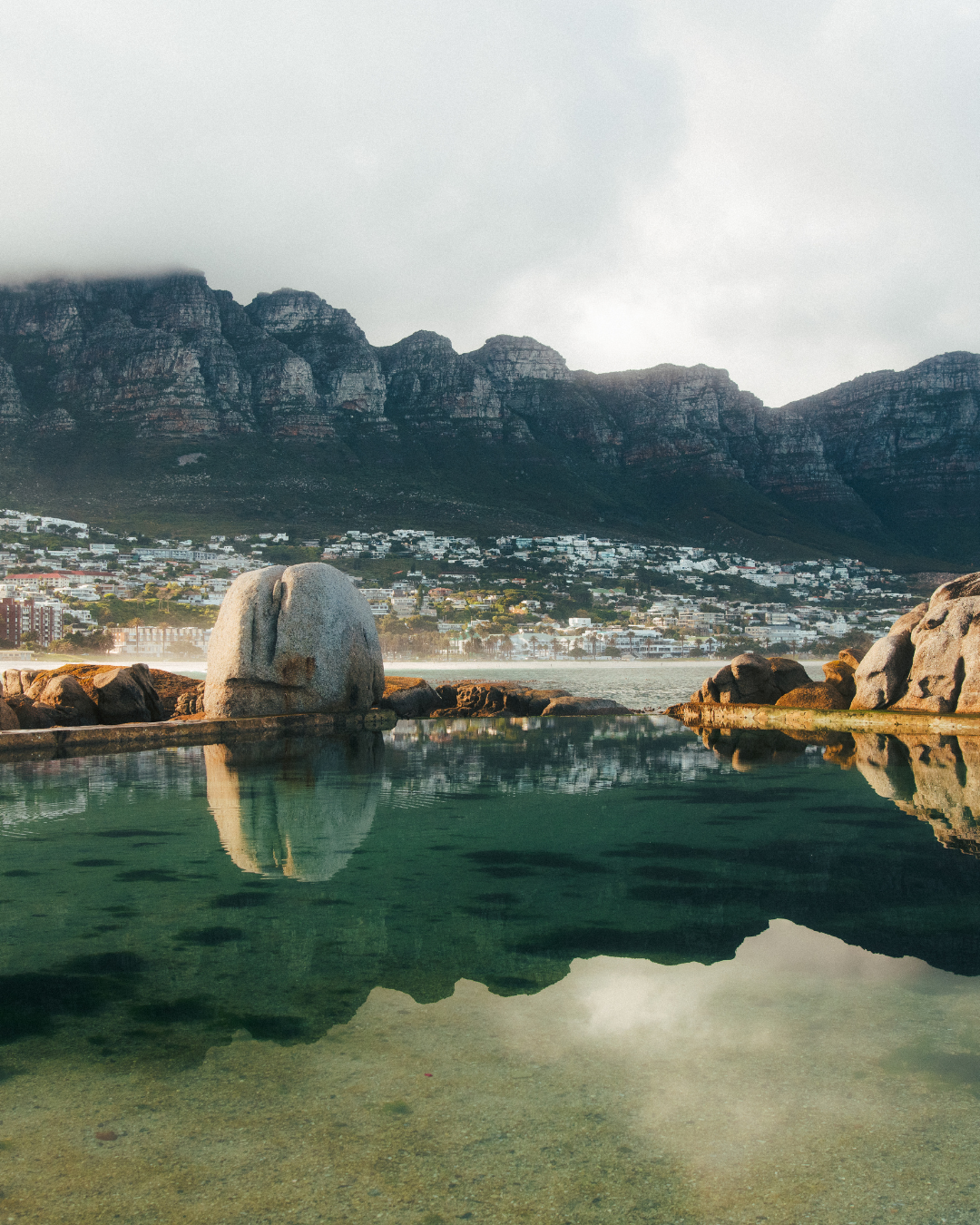 Maiden's Cove in Cape Town, with 12 Apostles and mountain scape in background