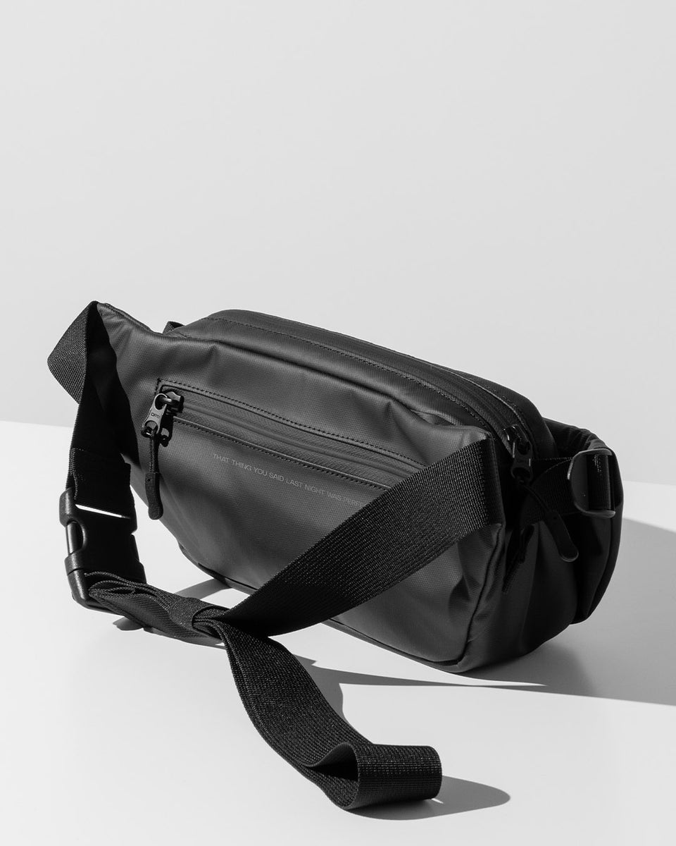 A studio shot of the back of the MOTH X Stubble & Co Crossbody Cooler