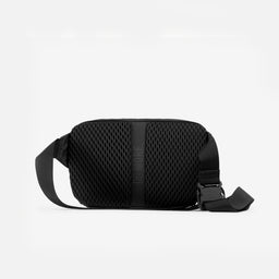 A studio shot of the back panel on the Charcoal Motion Sling 4L