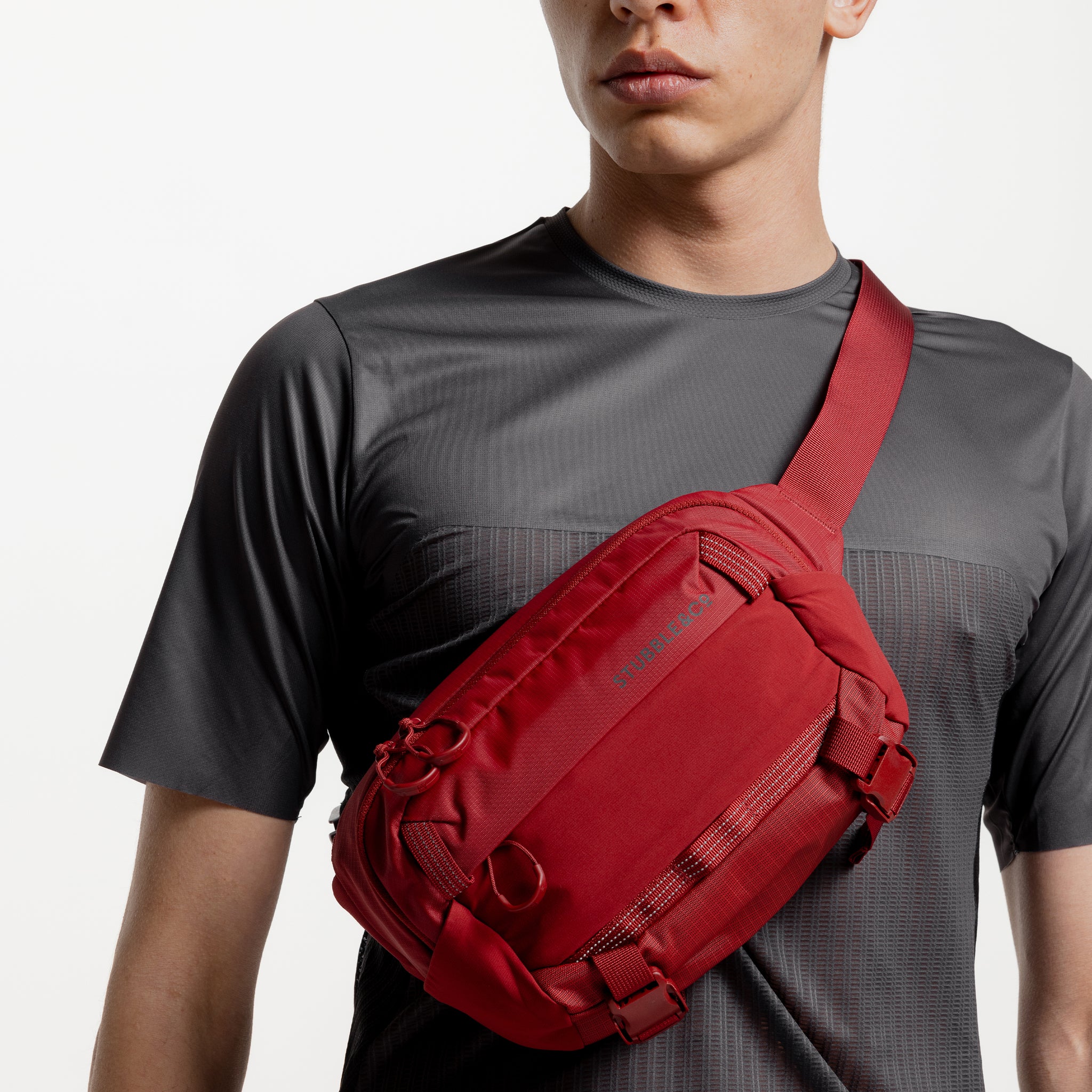A studio shot of the front of the Magma Motion Sling 4L being worn on the front of a man