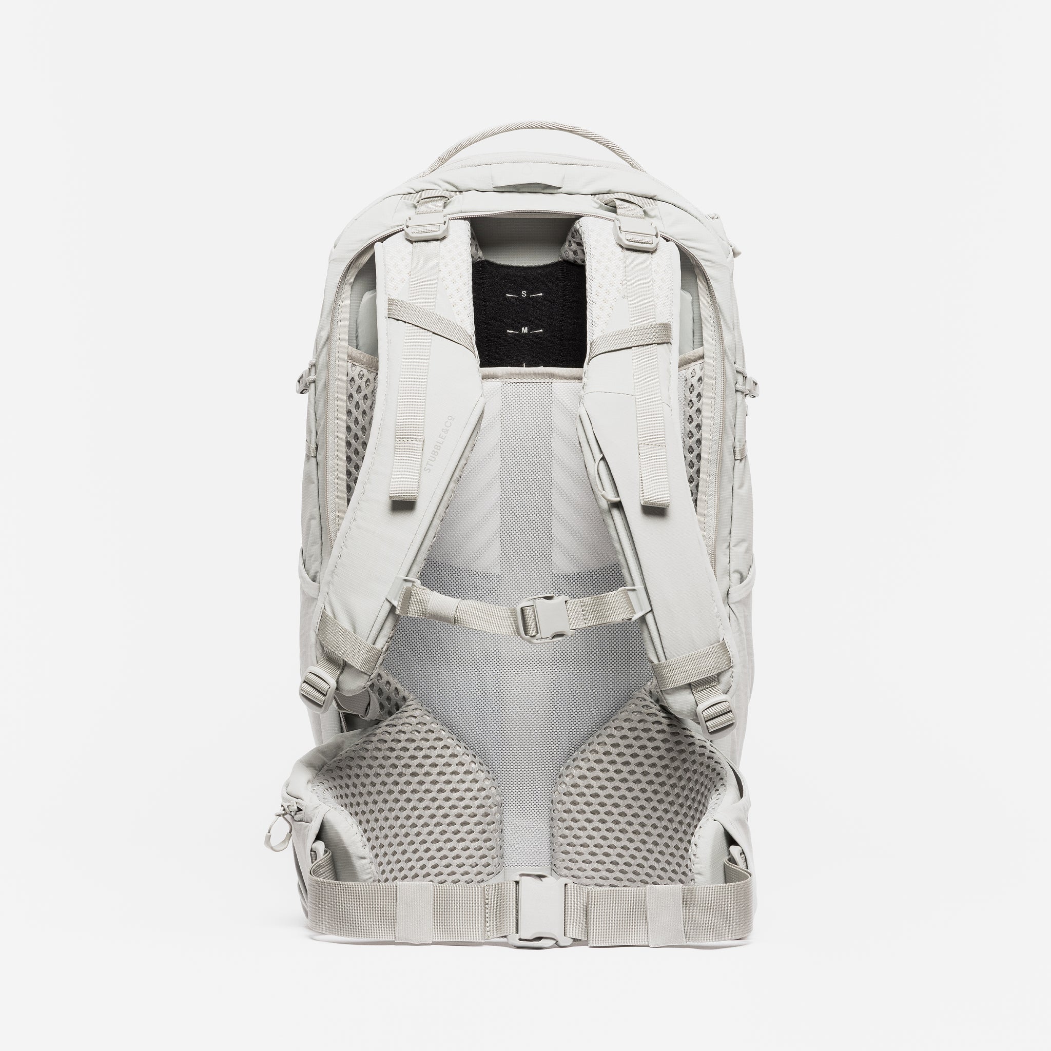 A studio shot of the back panel and adjustable torso adjuster on the Motion Adventure Pack 38L in Ash