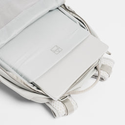A studio shot of the laptop compartment inside the Motion Adventure Pack 38L in Ash