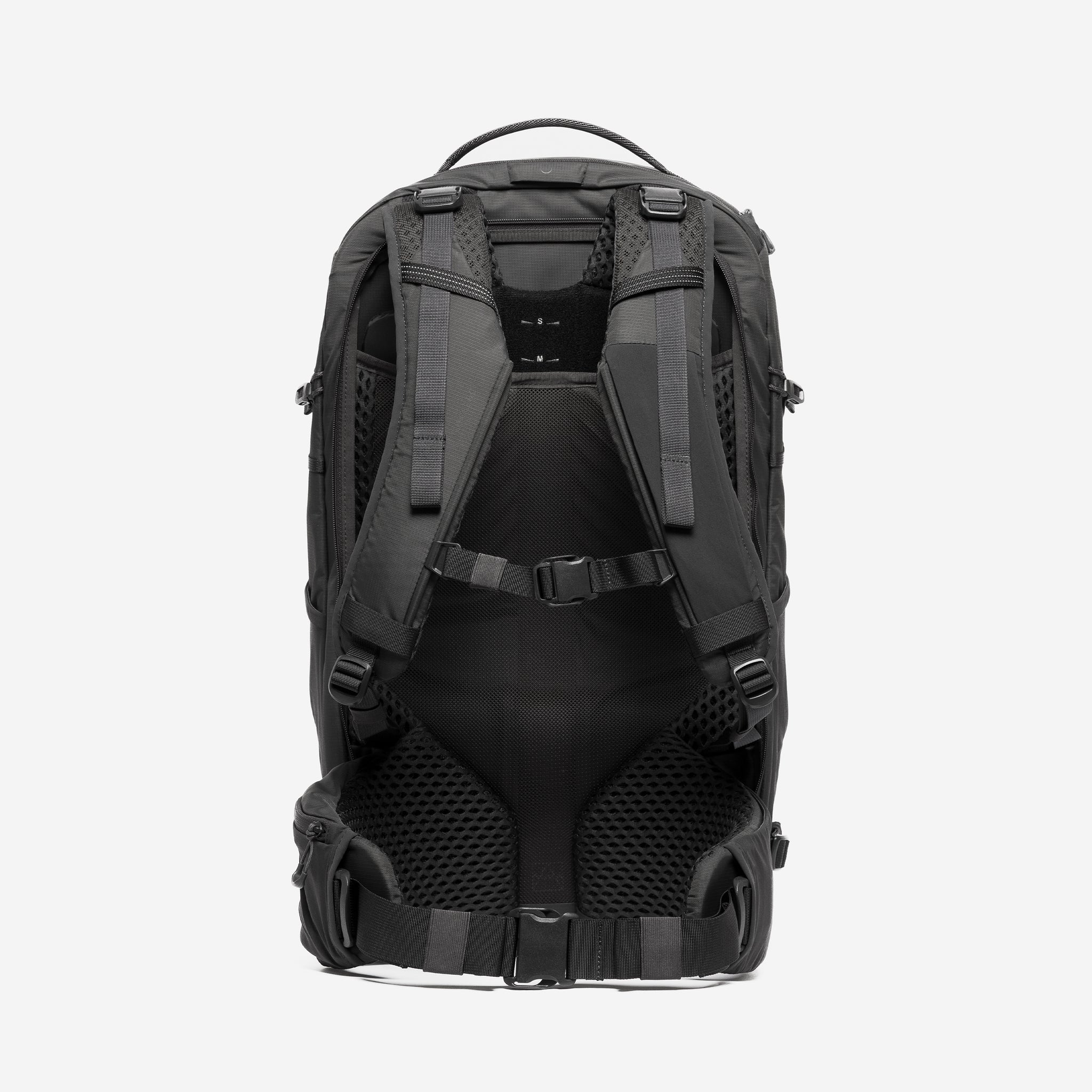 A studio shot of the back panel and adjustable torso height technology on the Motion Adventure Pack 38L in Charcoal