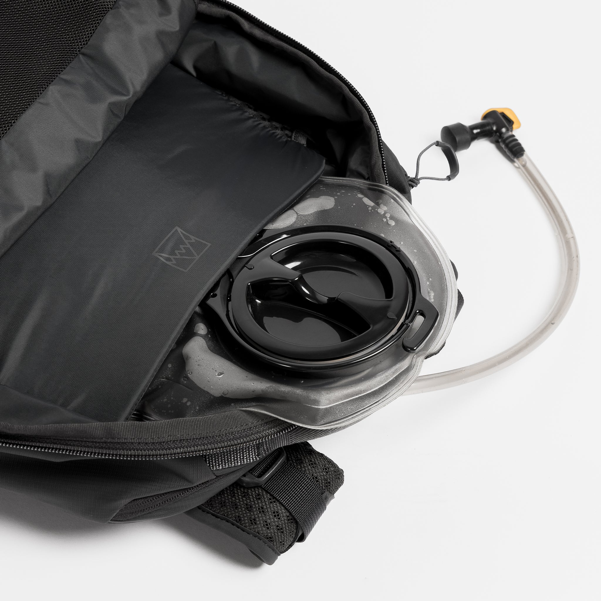 A studio shot of the hydration compartment within the Motion Adventure 38L in Charcoal