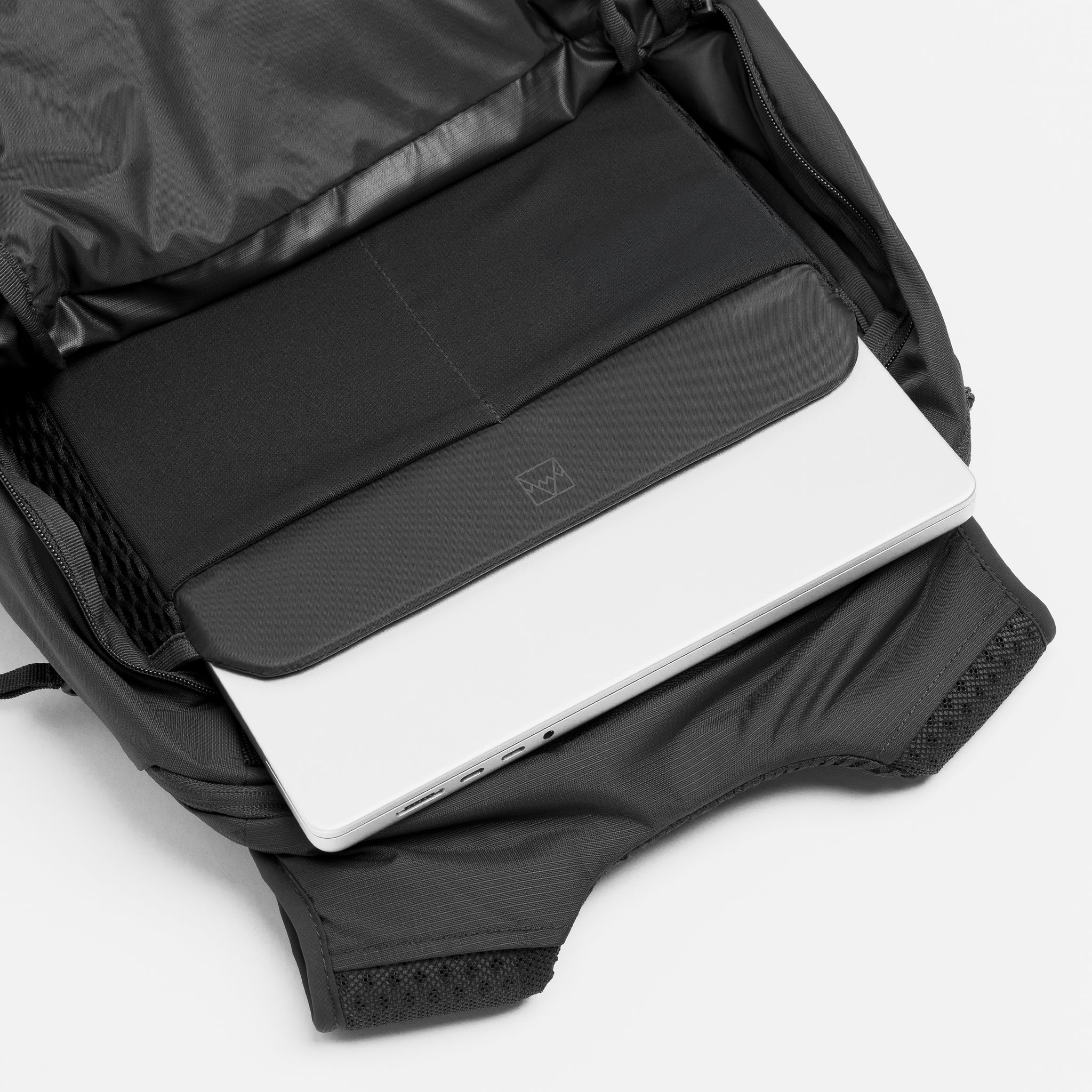 A studio shot of the interior laptop compartment in the Charcoal Motion Backpack 20L