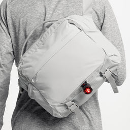 A close up shot of the bike light loop on the Motion Sling 15L in Ash, Magma and Charcoal