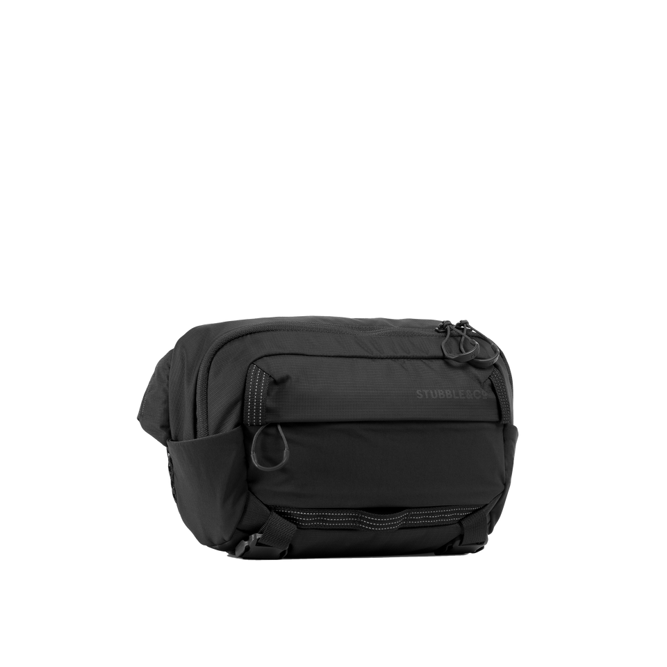 A studio shot of the front and side of an motion sling 4l as cut out transparent PNG-charcoal