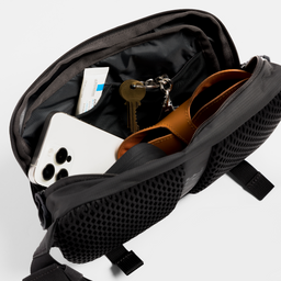A studio shot of the internal compartments within the motion sling l in Charcoal, Ash and Magma