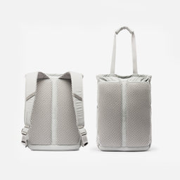 A studio shot of the back panel on the Ash Motion Tote Pack 18L showing the backpack straps and tote bag straps