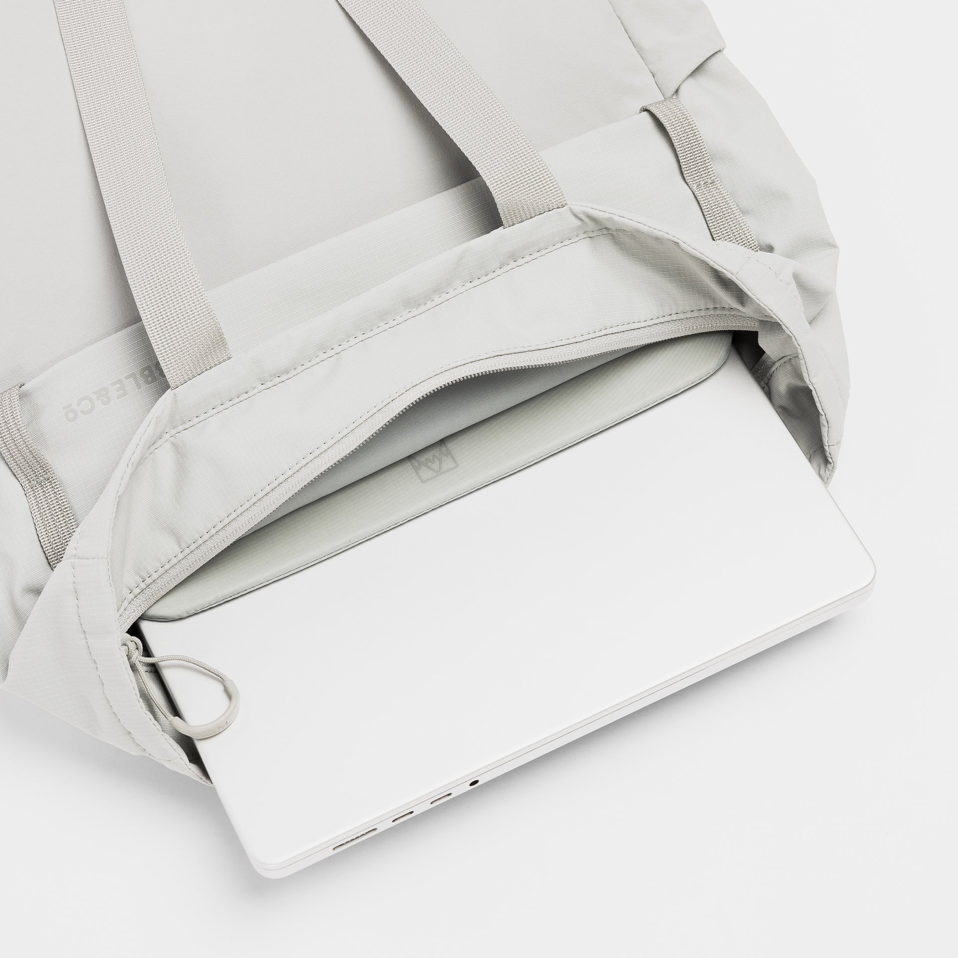 A studio shot of the interior Laptop Compartment within the Ash Motion Tote Pack 18L