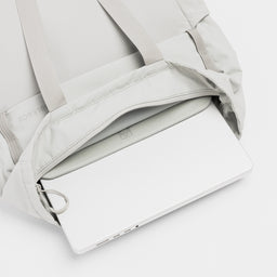 A studio shot of the interior Laptop Compartment within the Ash Motion Tote Pack 18L