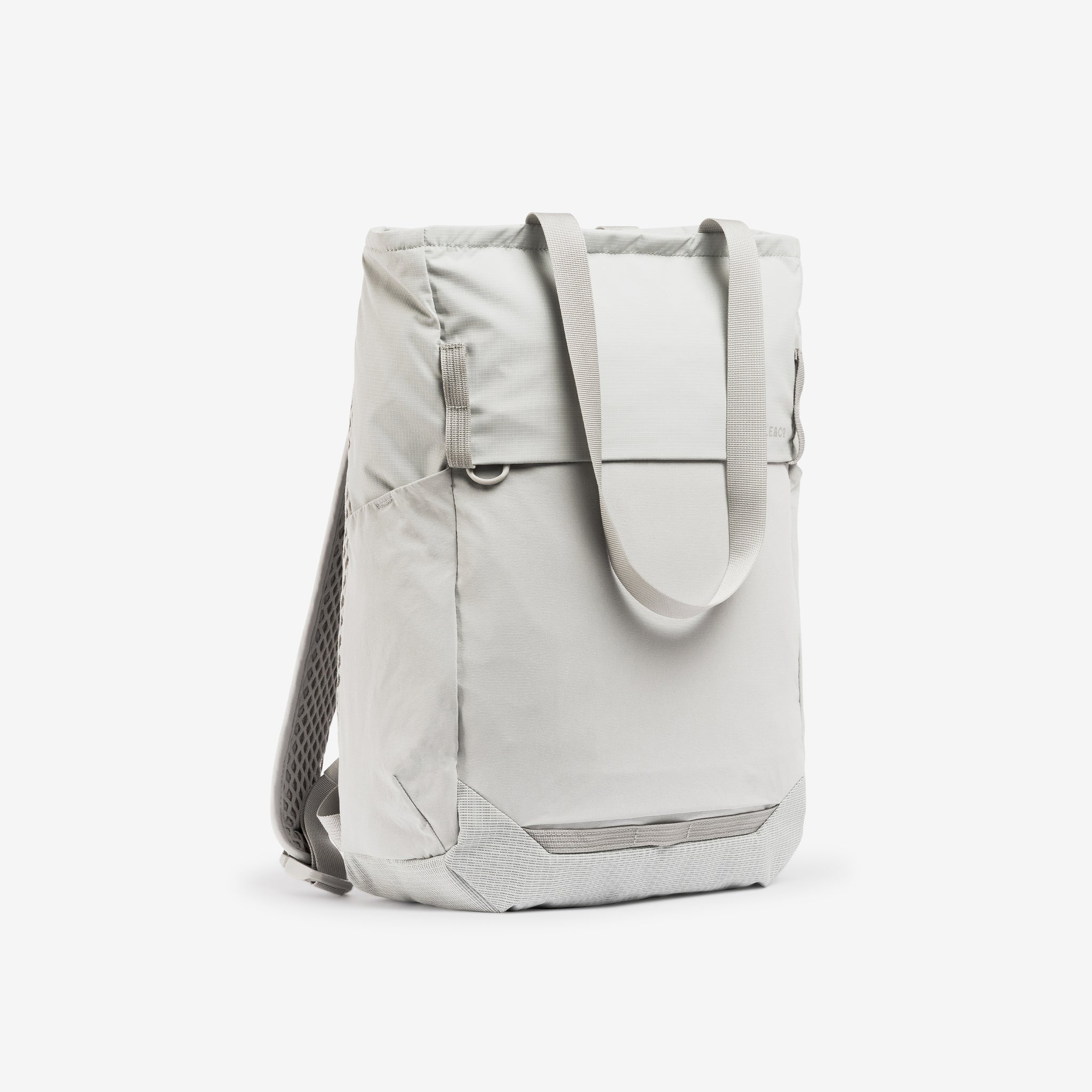 A studio shot of the front and side of the Ash Motion Tote Pack 18L