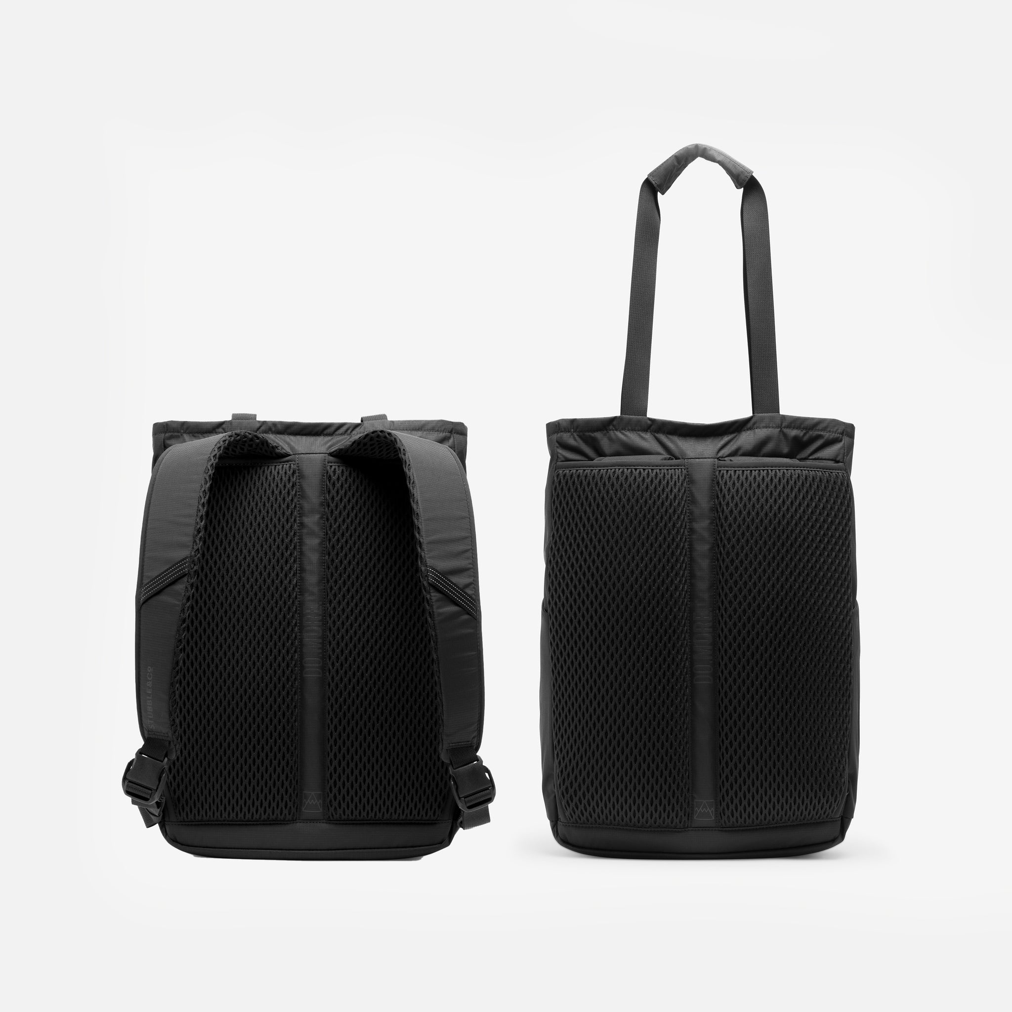 A studio shot of the back panel of the Charcoal Motion Tote Pack 18L with backpacks straps and tote bag straps