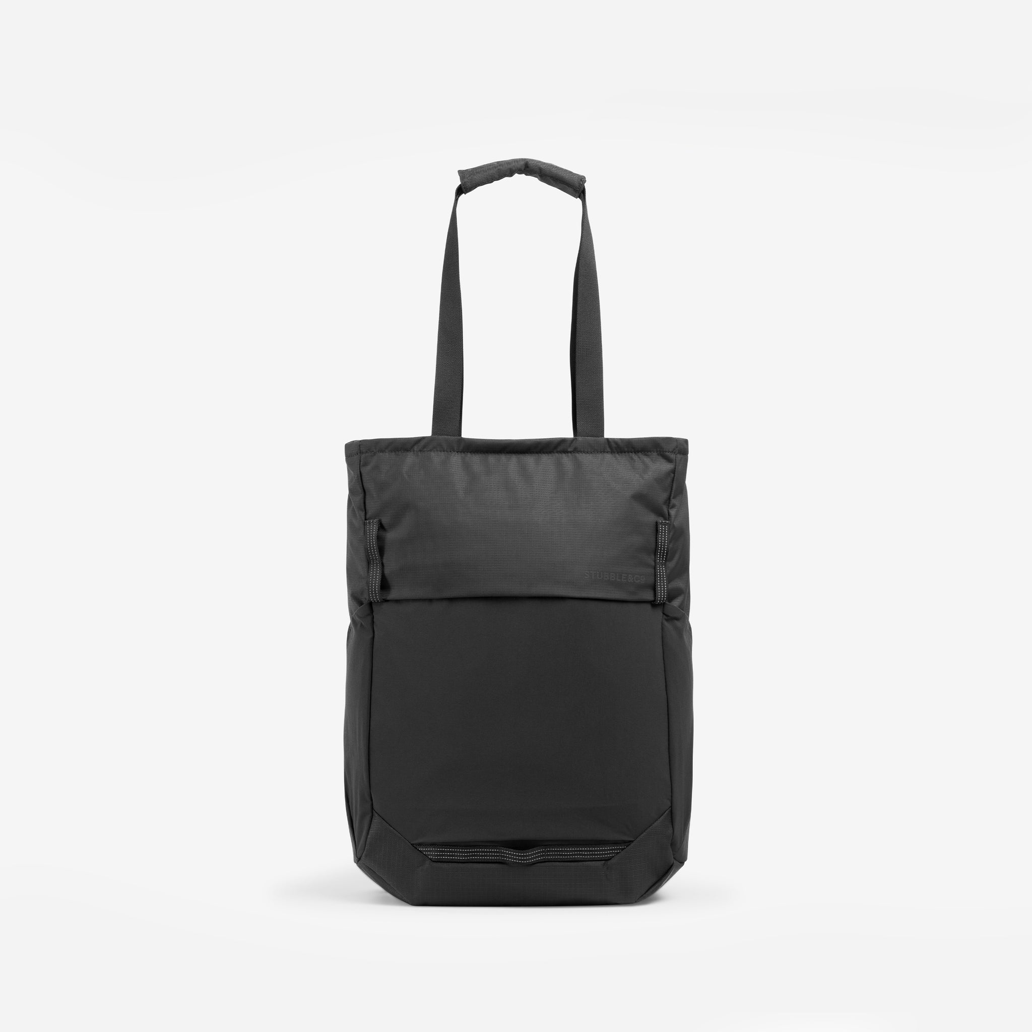 A studio shot of the front of the Charcoal Motion Tote Pack 18L