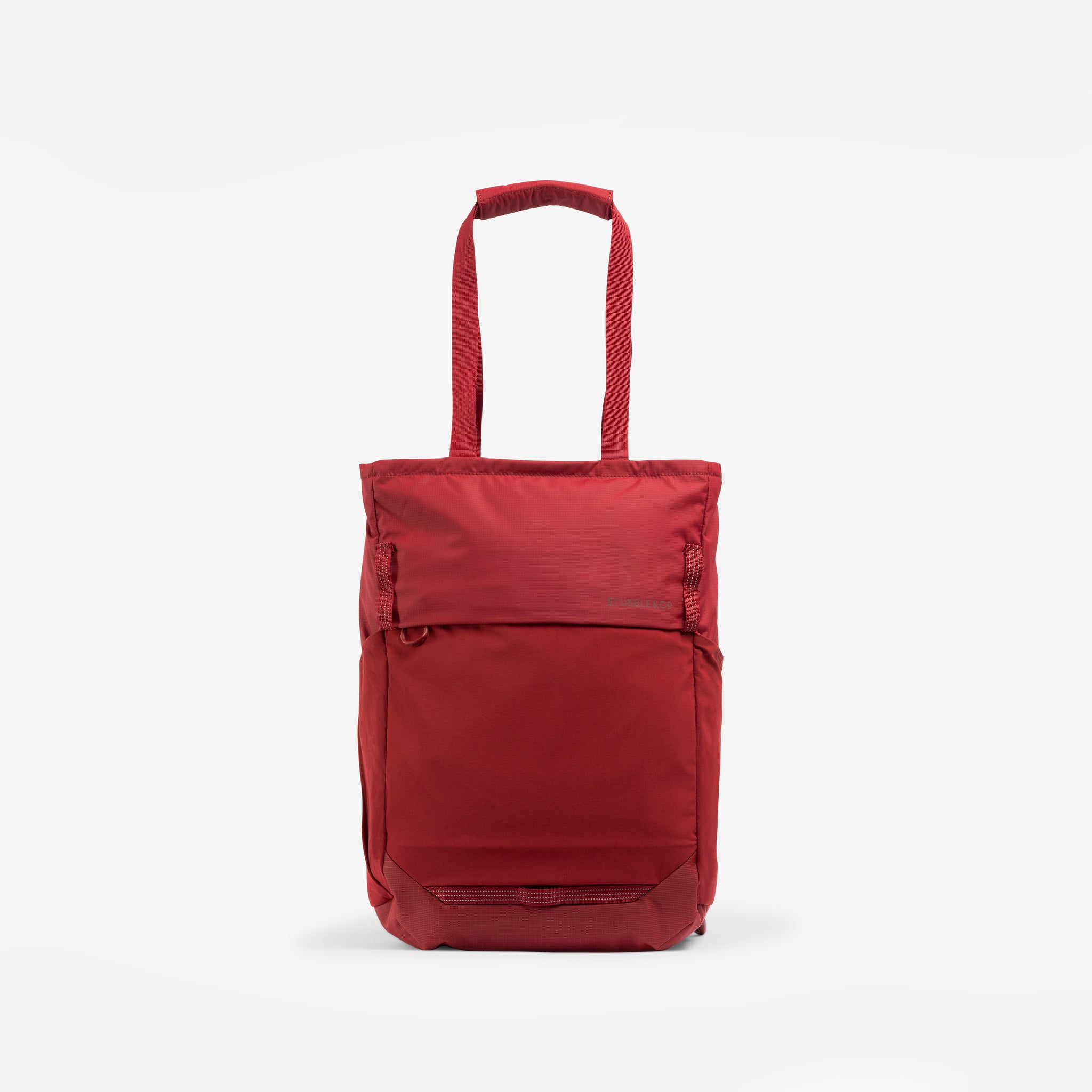 A studio shot of the front of the Magma Motion Tote Pack 18L with the tote bag straps up