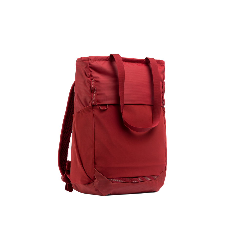 A studio shot of the front and side of an motion tote pack 18l as cut out transparent PNG- magma