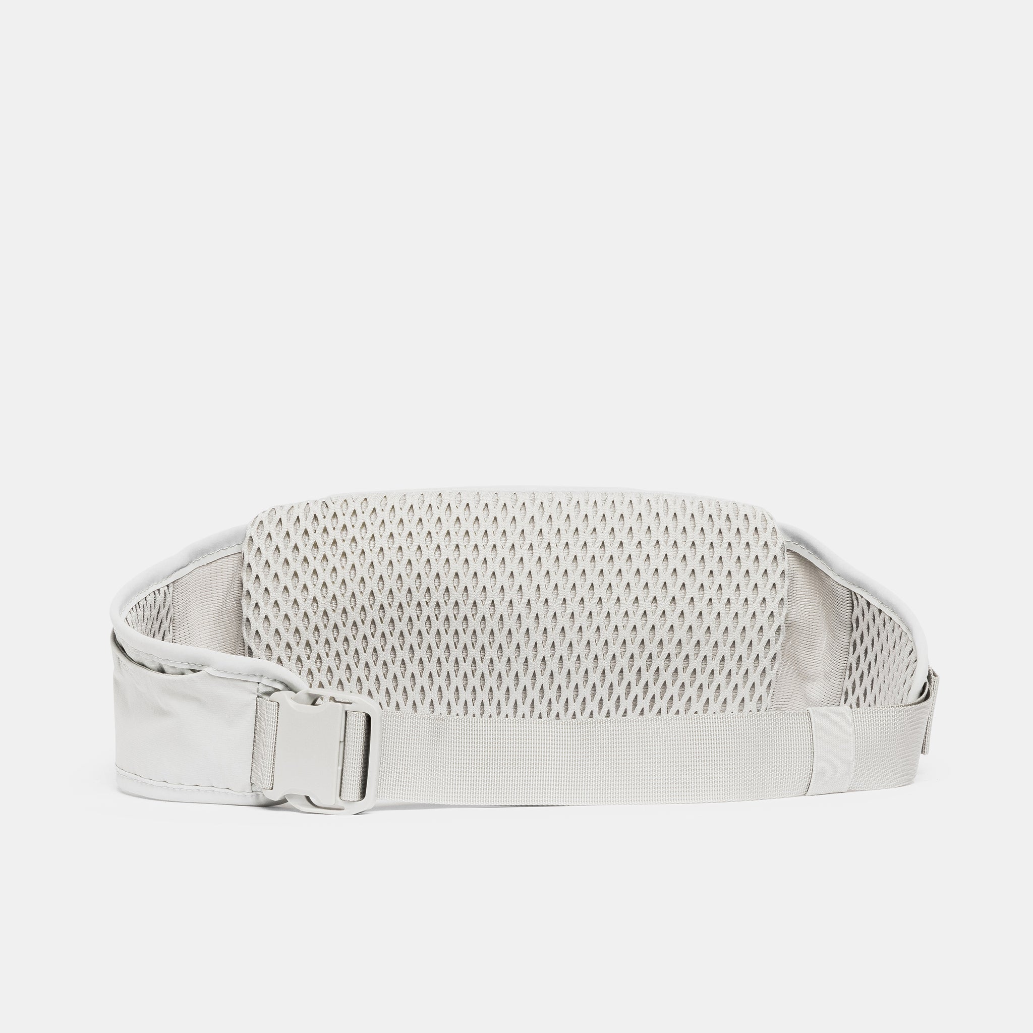 A studio shot of the back and quick release clip on the Ash Motion Waist Pack 2L