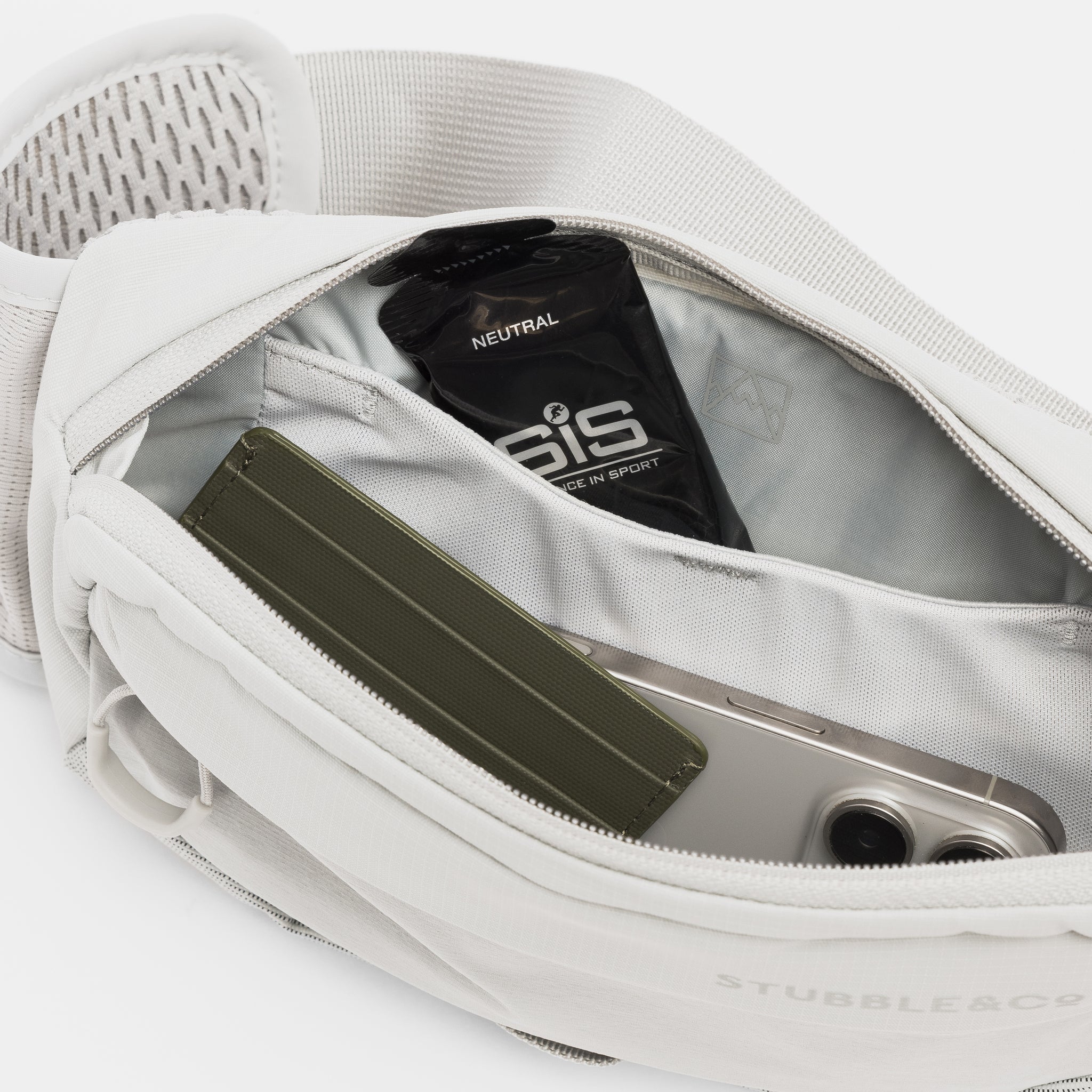 A studio shot of the interior compartments within the Ash Motion Waist Pack 2L