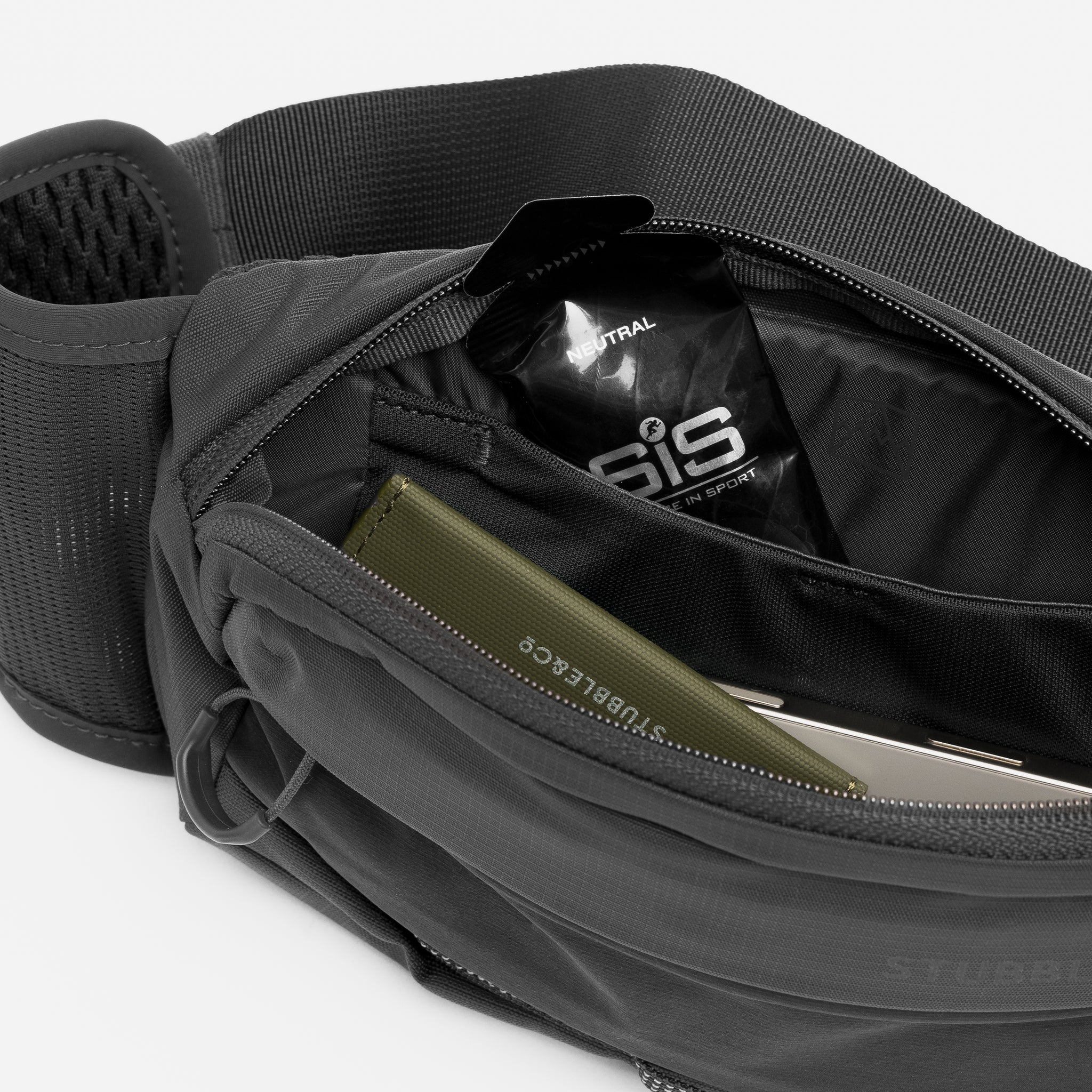 A studio shot of the interior compartments for the Charcoal Motion Waist Pack 2L