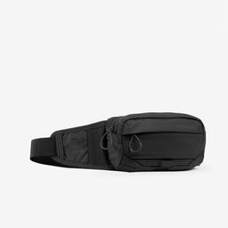 A studio shot of the front and side of the Charcoal Motion Waist Pack 2L