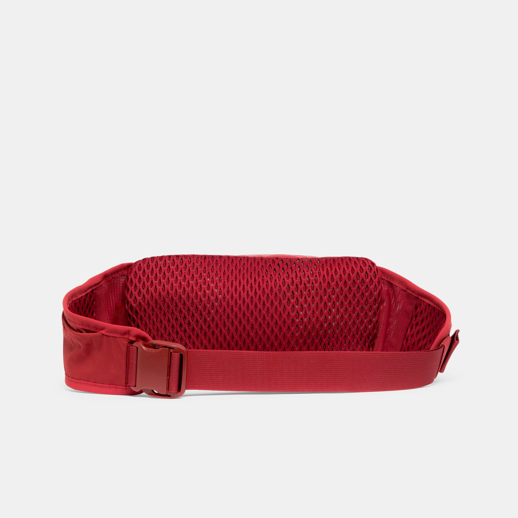 A studio shot of the back and quick release clip on the Magma Motion Waist Pack 2L