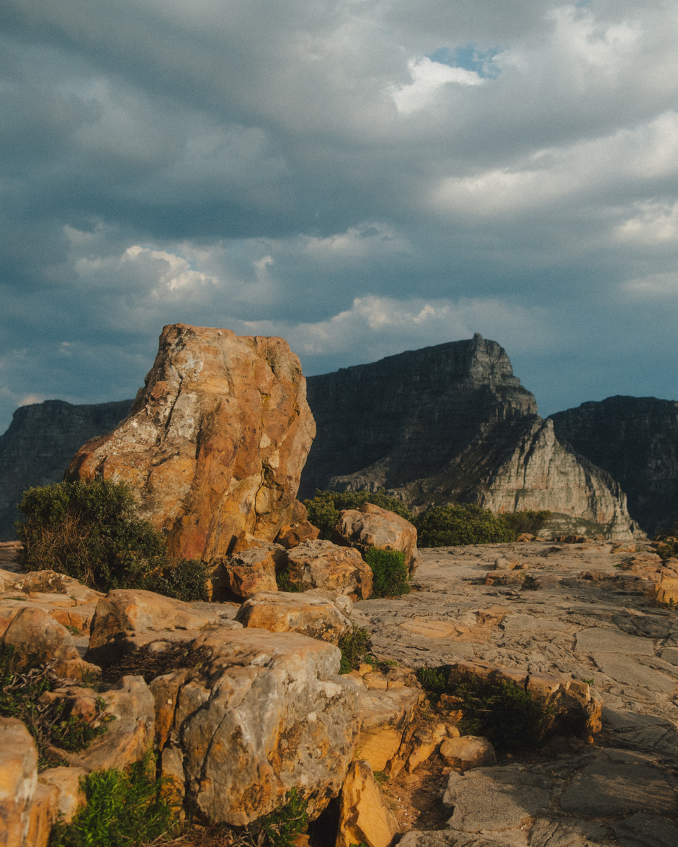 Sunlight hitting a rock formation at the top of Lion's Head Mountain in Cape Town