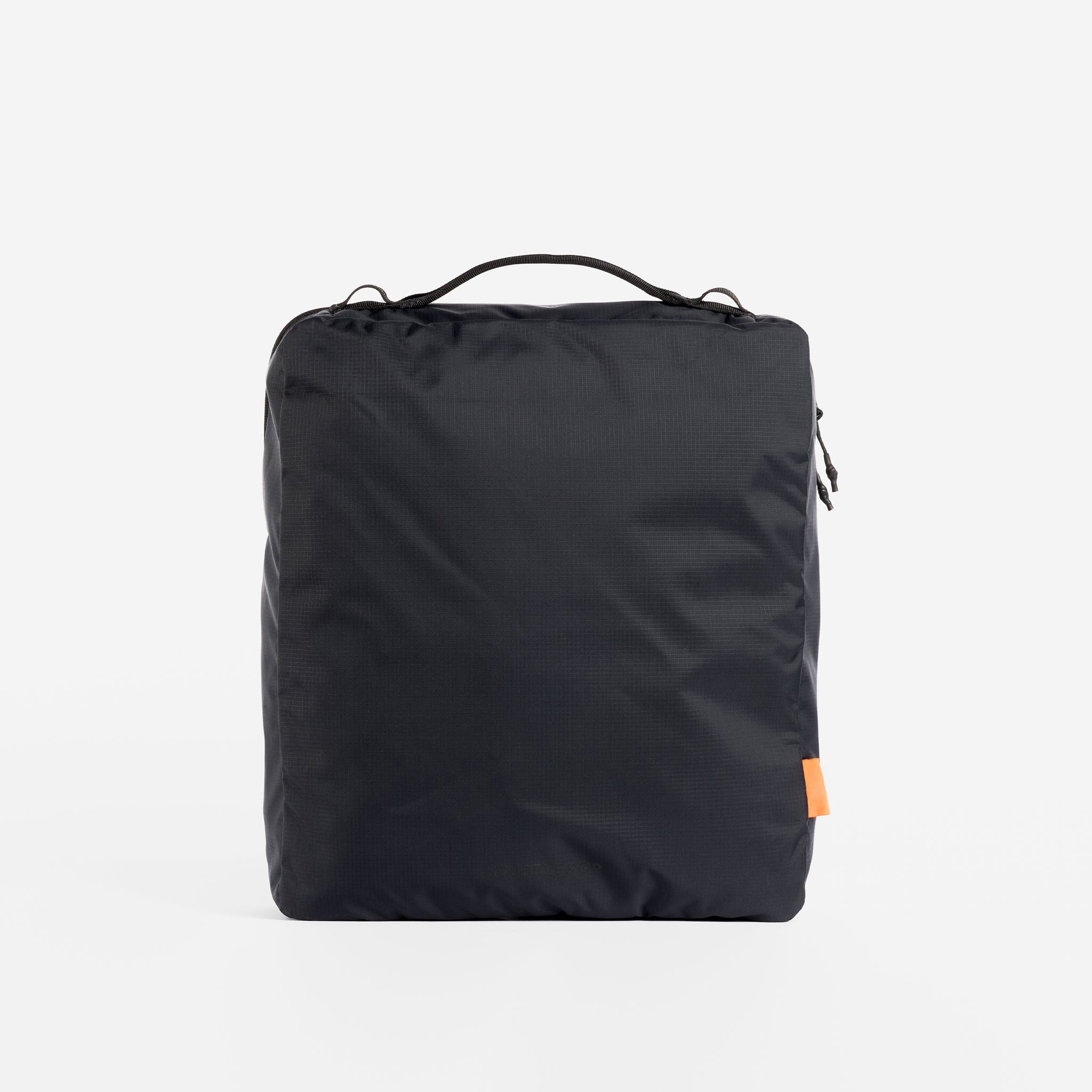 A studio shot of the back of an All Black packing cube 11l