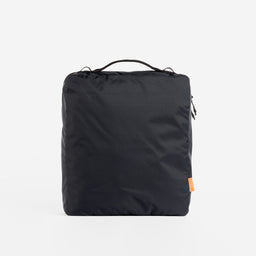 A studio shot of the back of an All Black packing cube 11l