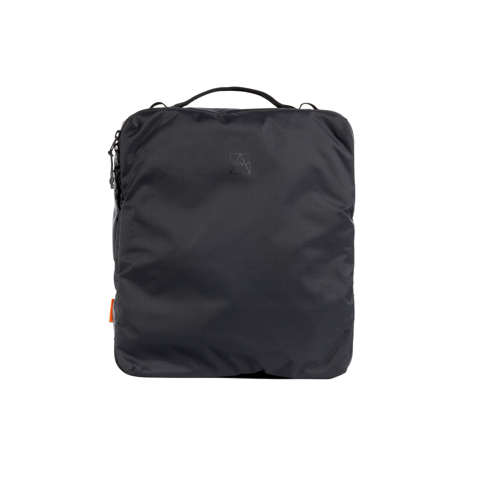 A studio shot of the front and side of a Packing Cube 11l as cut out transparent PNG-  black