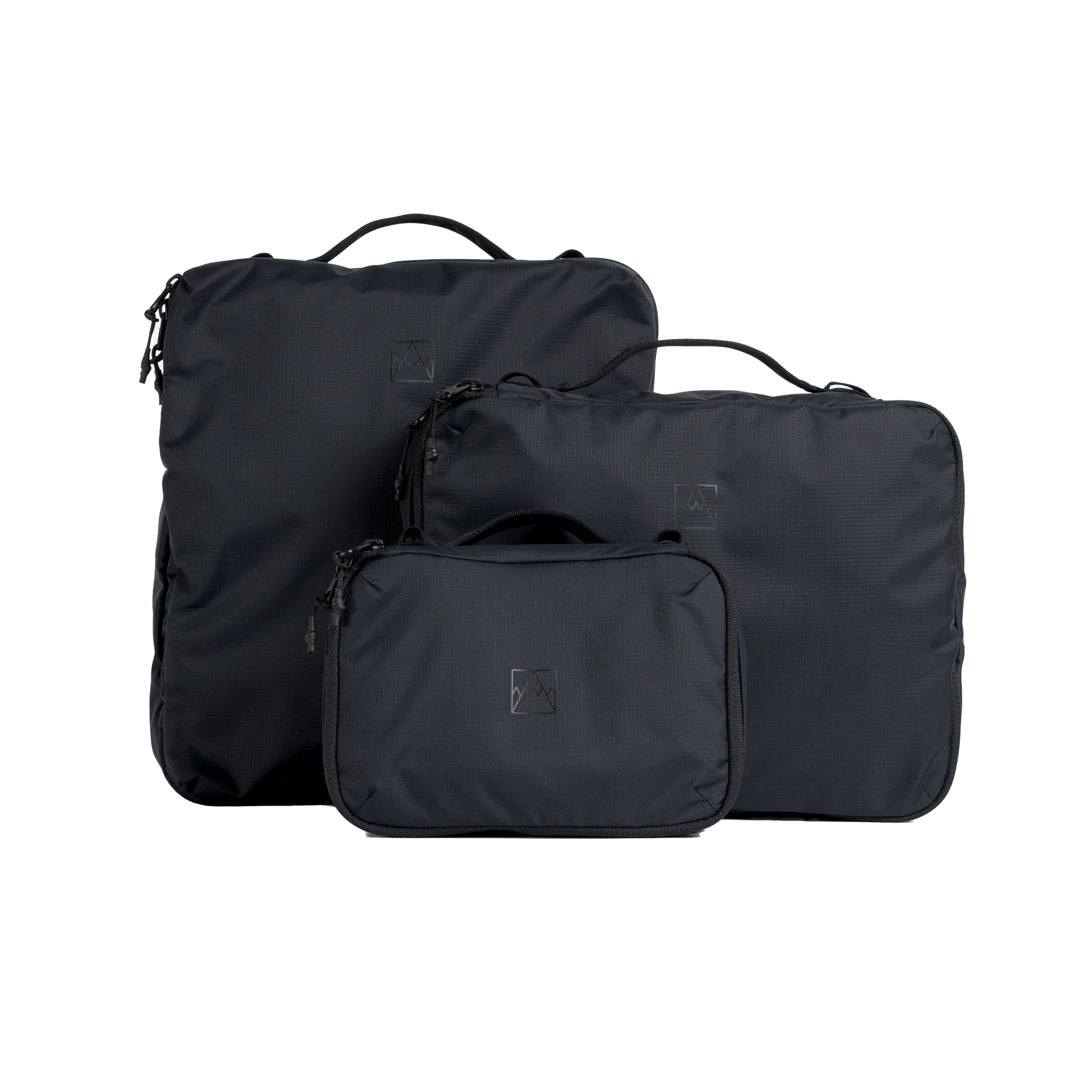 A studio shot of the front and side of a Packing Cube set of 3 as cut out transparent PNG-  black