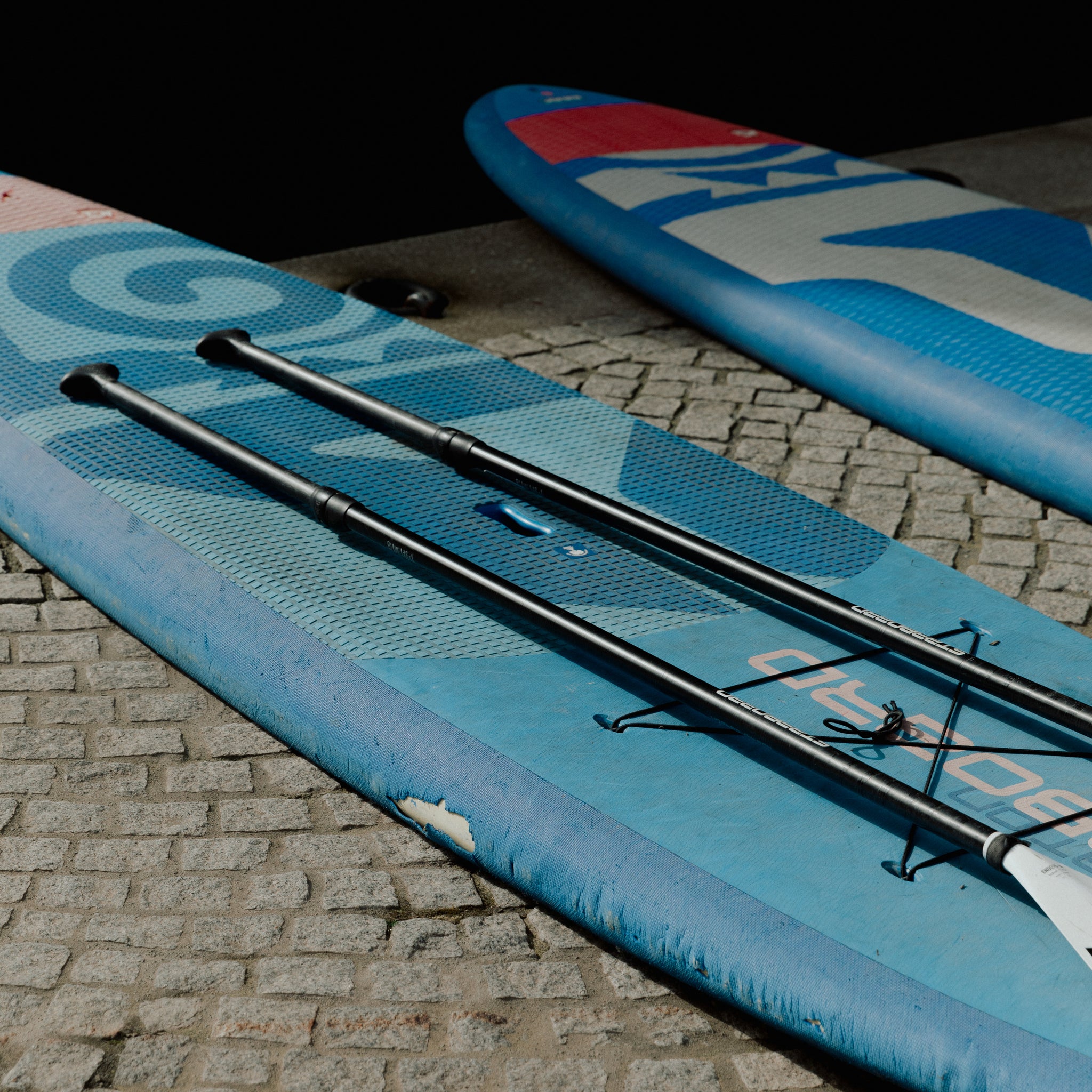 Paddle boards on the river side