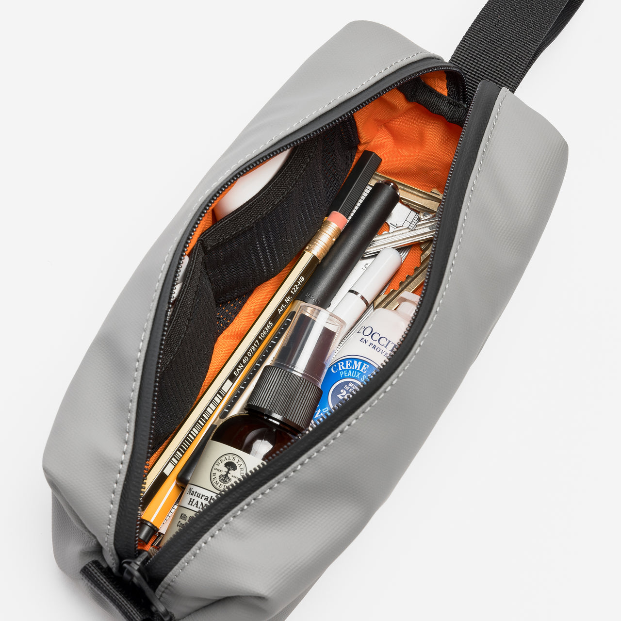 A studio shot of the packed interior of the pencil case in Concrete