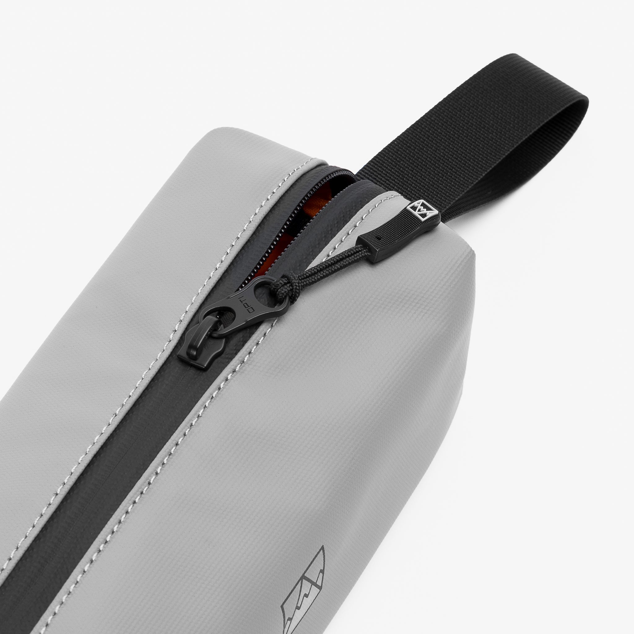 A studio shot of the close up of the zip on the pencil case in Concrete