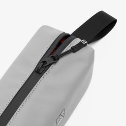 A studio shot of the close up of the zip on the pencil case in Concrete