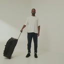 A studio video of the All Black Wheeled Duffel 80L in All Black showing all the features