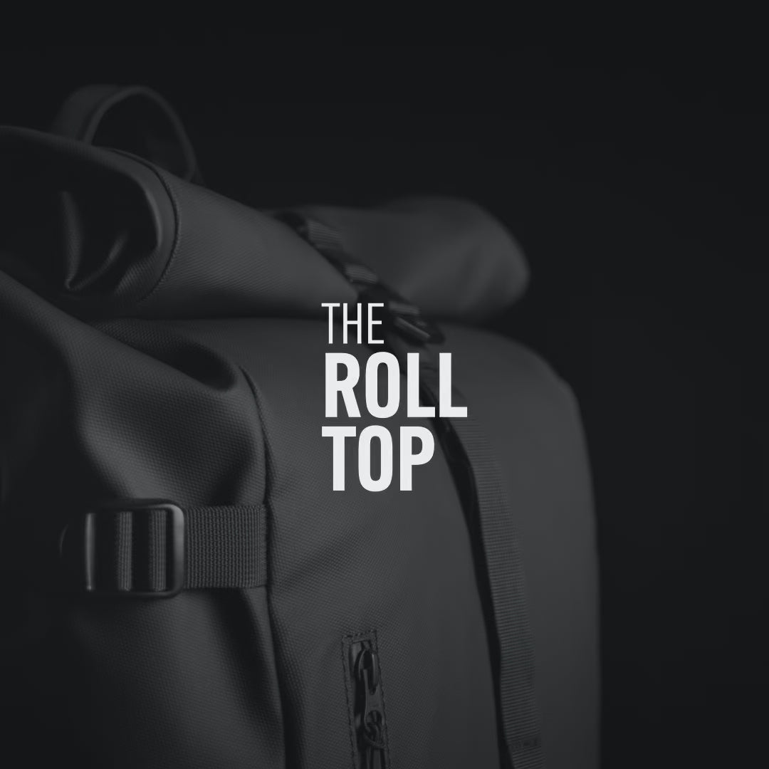 The Roll Top Backpack in All Black showing product features and benefits, also in Tasmin Blue, Urban Green, Earth Red, Concrete, Arctic White, Sand, Ember Orange, Matcha