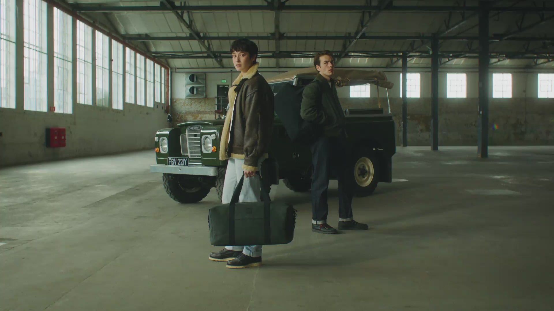 A lifestyle video showing a man and woman using the Weekender Duffel 30L- landscape